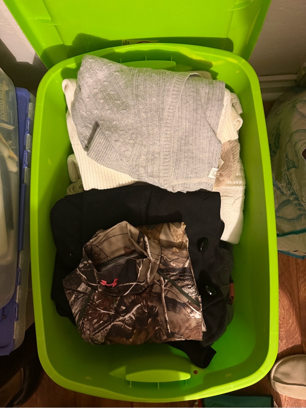 Large tote of women’s sweaters